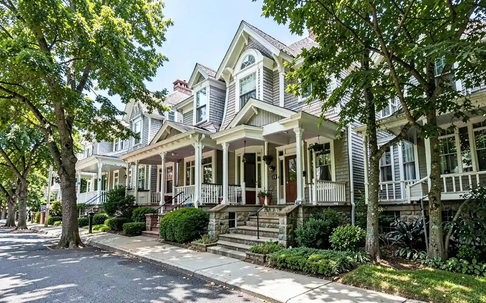Victorian homes with deep porches and stone steps in Newton Highlands, MA