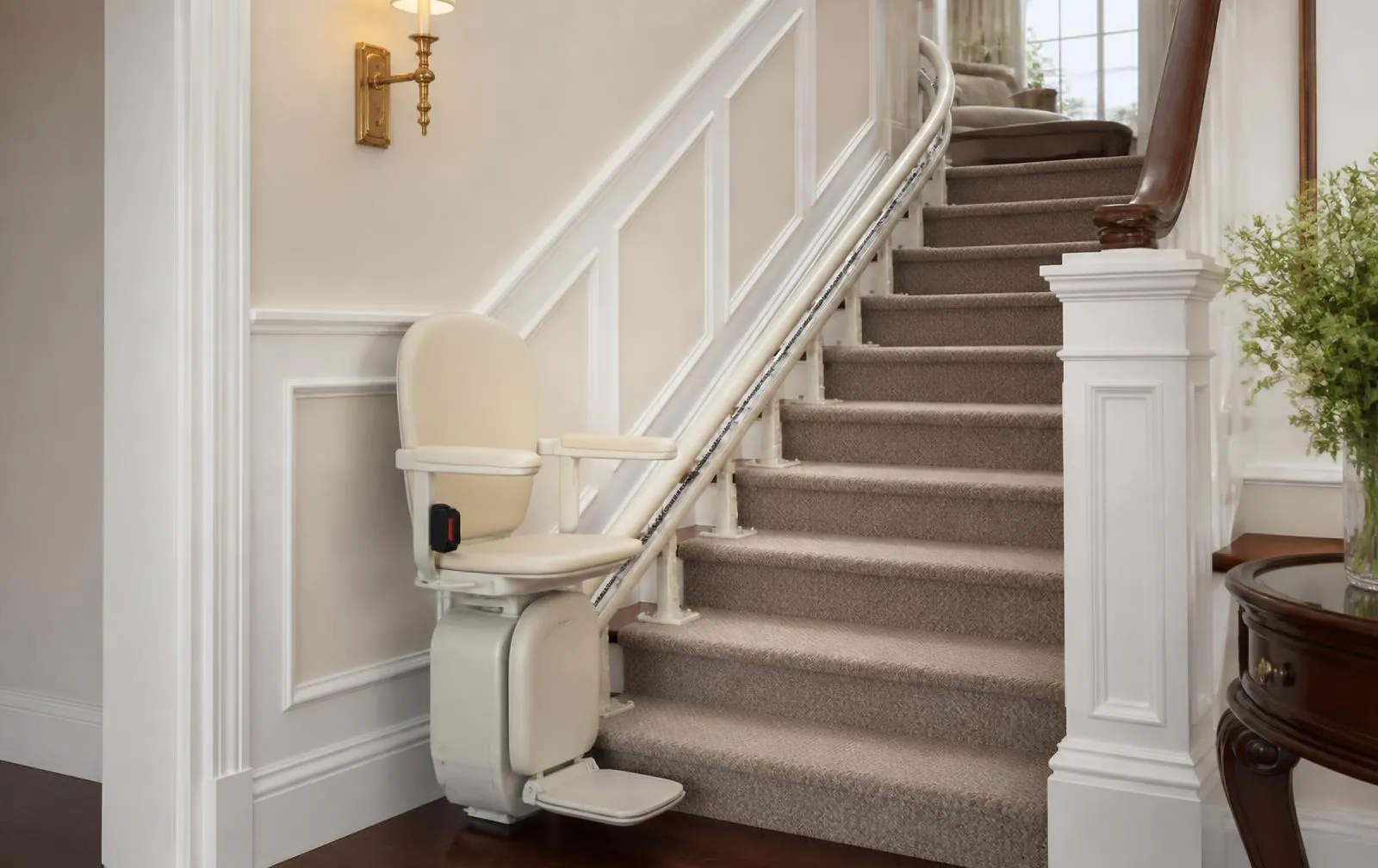 Curved stairlift with the rail mounted to the stair treads in an upscale Newton, MA home